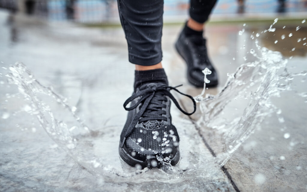 A person running in a puddle